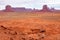 Towering sandstone buttes of Monument Valley Navajo Tribal Park under cloudy sky, Arizona