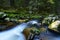 Towering stones in foamed water