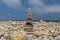 Towers of balanced dolomite stones on the beach