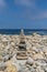 Towers of balanced dolomite stones on the beach