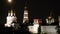 Towers, domes and white-stone wall of Novodevichy Convent at night in Moscow.