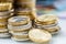 Towers with euro coins stacked together - close-up