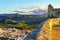 Towers of Olvera Castle on the mountain dominating the town of white houses, Cadiz, Spain.