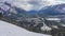 Town of Banff in snowy winter season. Snow Capped Mount Rundle, Sulphur Mountain in background