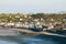 The town center of Arromanches les Bains and its beach at low tide in Europe, France, Normandy, Arromanches les Bains, in summer,