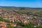 Town center with buildings, streets, and vegetation in Rupea, Romania