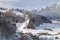 Town at the foot of the snow-capped mountains.