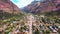 Town of Ouray tucked into flat valley surrounded by mountains