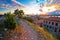 Town of Pula coastline and shipyard cranes sunset view