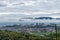 In the town after the rain, there are clouds in the mountains in the distance