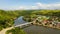 Town on the river bank and road bridge, top view. Road bridge on the island of Samar, Philippines.