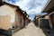 Town, sky, road, neighbourhood, infrastructure, street, alley, wall, village, residential, area, house, city, lane, slum, facade,