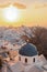 Town of Thira on the island Santorini, famous church against colorful sunset in Greece