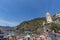 Town of Vernazza with beach view and tourists and sunbathers