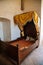 Town Zebrak in Central Bohemia, Czech Republic, 24 July 2021: Medieval royal gothic castle Tocnik, interior with four-poster bed,