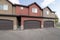 Townhouse exterior with garage and sliding glass windows