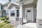 Townhouse exterior with white front door and bay windows