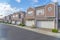 Townhouse garages with stones and plants on the driveway at Southern Californa