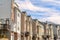 Townhouses on scenic neighborhood in winter with snowy mountain peak background