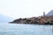 Townscape panorama of lakeside village Limone sul garda with boats and church at Lake Garda