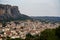 Townscape scenic aerial view of Kalambaka ancient town with beautiful rock formation hill, natural boulders pillars and sky