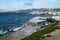 Townscape view of little Venice, Aegean deep blue sea coastline, white buildings with mountain and sky background, Mykonos