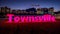 Townsville, Queensland, Australia - Townsville town sign illuminated at night in a picturesque location