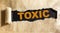 Toxic the word is written