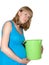 Toxicosis. The pregnant woman holds a plastic bucket