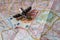 Toy Airplane and Money Scattered on Tourist Map