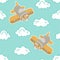 Toy airplanes among fluffy clouds on a blue background with blue hearts