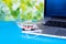 Toy ambulance car white medical mask blue green laptop background covid 19