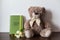 Toy bear and family diary with green leather cover