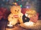 Toy bear, night lamp and candles on the wooden table
