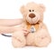 Toy bear stethoscope in hand medical medicine