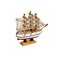 Toy boat sailboat on a wooden stand isolated on a white background