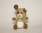 A toy brown dog sits on a white background. Toys for children, soft plush animals