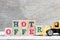 Toy bulldozer hold letter block R to word hot offer on wood background