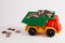 A toy car is carrying a full load of coins..