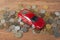 Toy car on coins. Loan, insurance and saving concept.