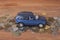 Toy car on coins. Loan, insurance and saving concept.