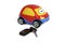 The toy car with keys and a charm