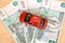 Toy car stands on paper Russian money