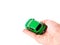 Toy car woman hand. Purchase insurance travel concept isolated