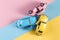 Toy cars in accident on a pastel colorful background