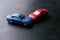 Toy cars crash accident. Simulation red and blue car