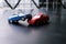 Toy cars crash accident. Simulation red and blue car