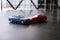 Toy cars crash accident. Simulation red and blue car