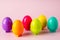 Toy colored plastic eggs on a pink background. Toy bright Easter background. Montessori Easter concept. Easter eggs for children