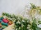 toy decorated bicycle with white flowers and multi-colored thread for sewing on a white background